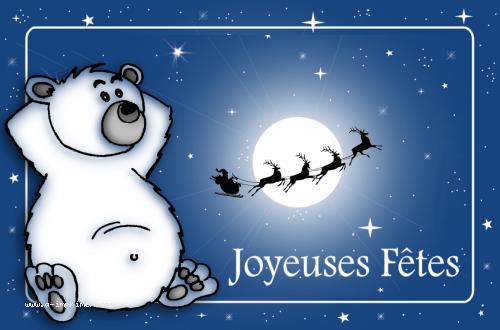 Carte postale Joyeuses fêtes : Ourson blanc et traineau du père noël passant devant la lune.